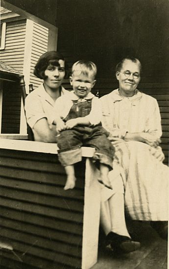 photograph of a young J. W. Fiegenbaum with Mom and Grandmother on the front portch of the home at Maimi, Oklahoma