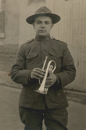photograph of Louis A. Gerber in his army uniform holding a brass horn