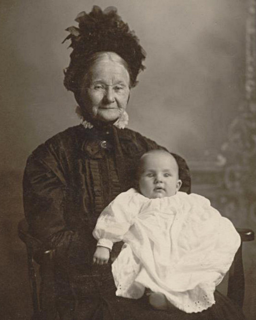 photographic studio portrait of Christine E. Wellemeyer and her infant great-grandson, Andrew J. Wellemeyer